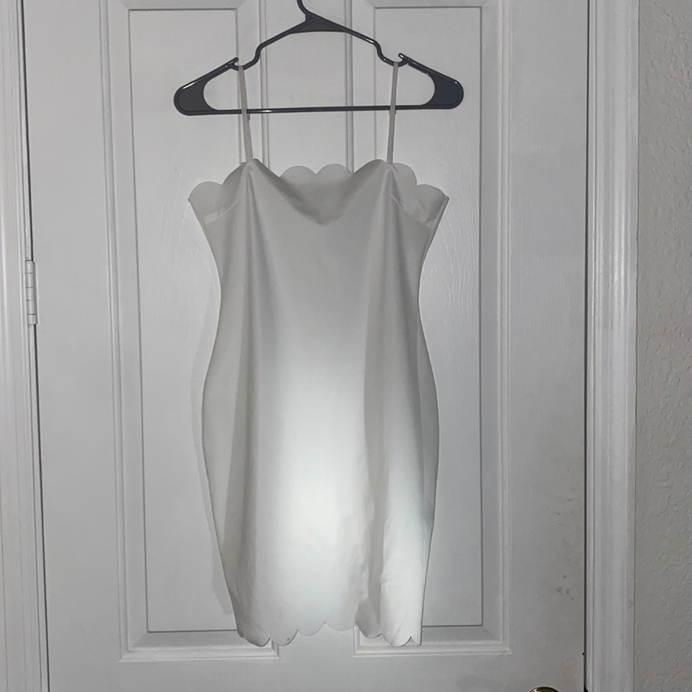 Scalloped edge white mini dress